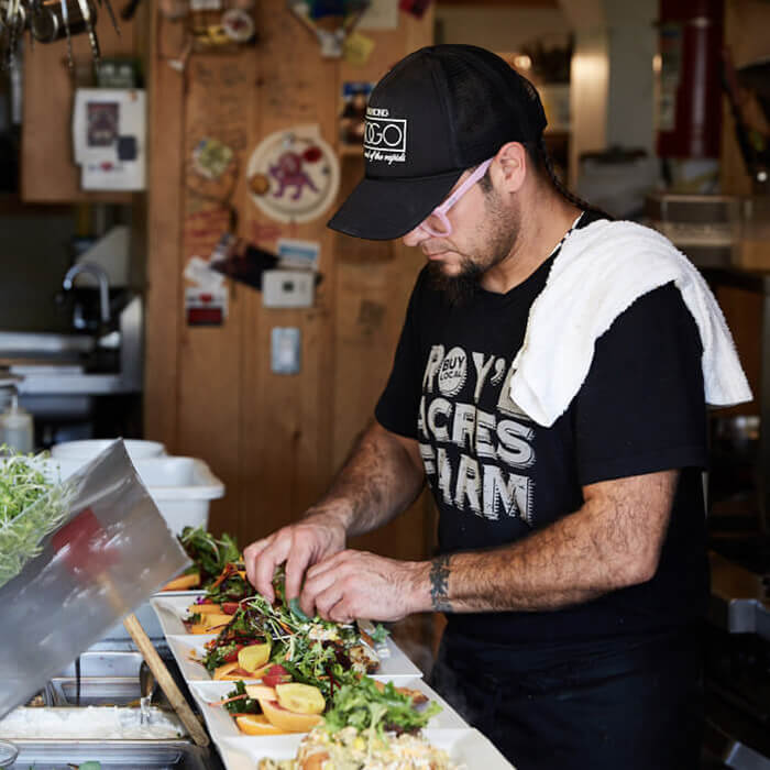 Preparing food at Powwow Cafe